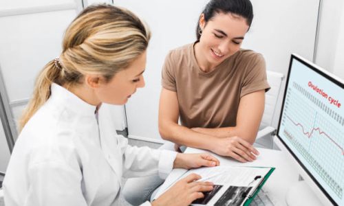 Patient woman receives consultation from her reproductive specialist. Gynecologist, pregnancy planning. Ovulation calendar and good days for fertilization
